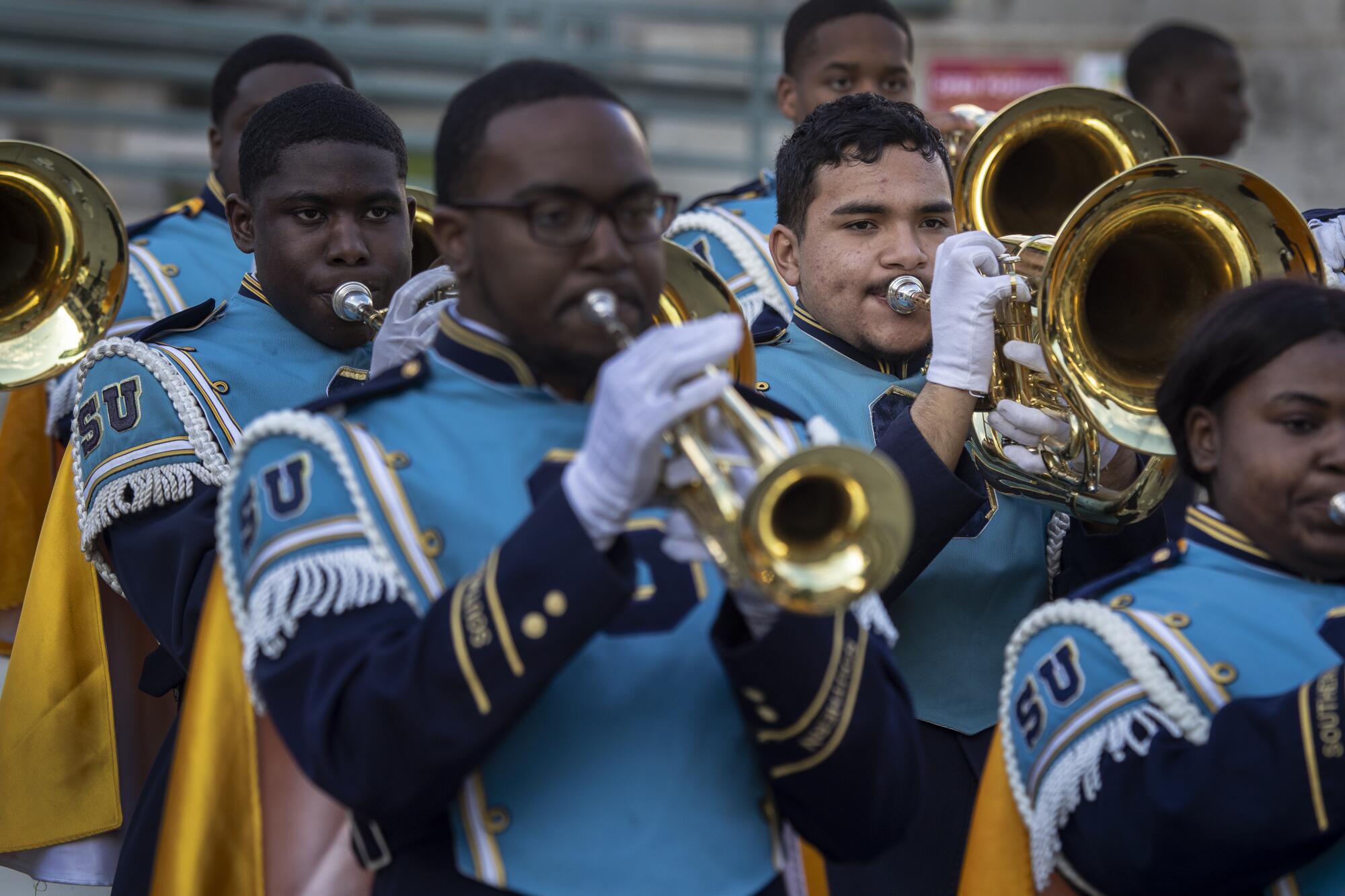  Zaid Soberanis-Ramos, right, warms up with his 200-plus member squad, the Southern University marching band, a.k.a. the “Human Jukebox,” at Pasadena City College.