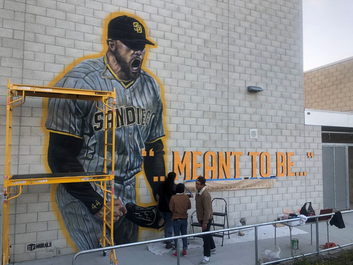 Artists commissioned by Padres work on mural at Grossmont High to honor Joe Musgrove for his no-hitter.