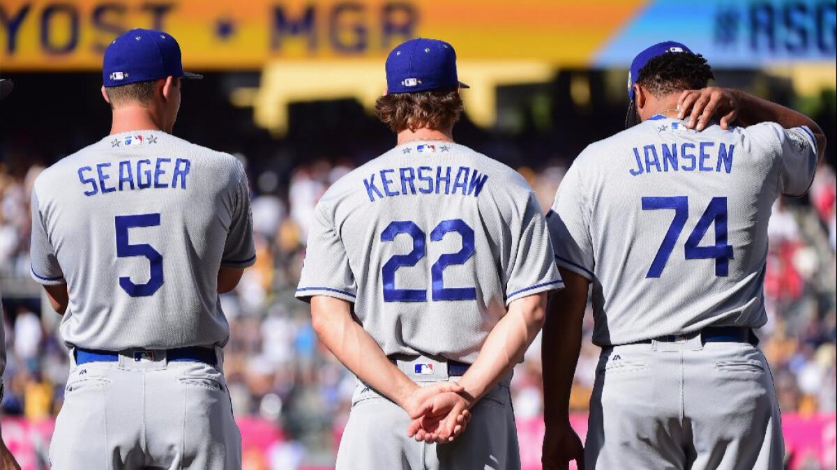 Dodgers Corey Seager, Clayton Kershaw and Kenley Jansen stand on the field before the All-Star Game on July 12.