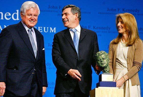 Senator Edward M. Kennedy (D-Mass.) and Caroline Kennedy present British Prime Minister Gordon Brown with a bust of President Kennedy after an address by Brown last month in Boston.