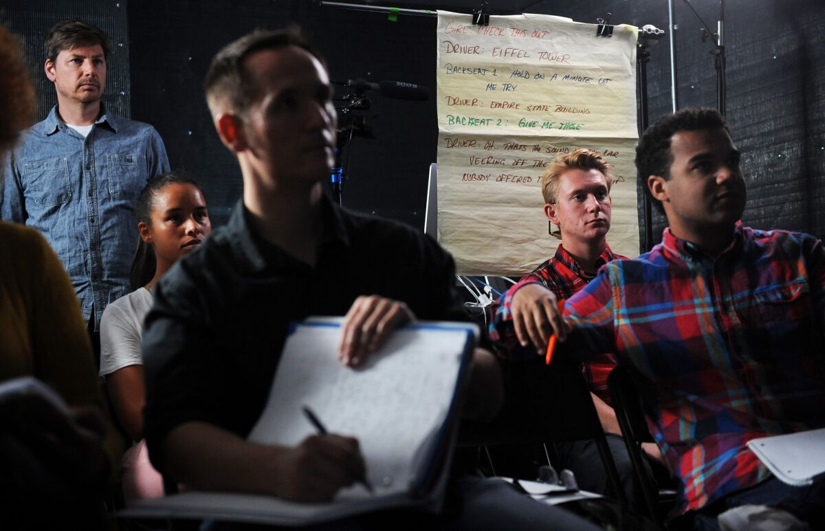 Students listen as Killian McHugh speaks in one of his acting workshops.