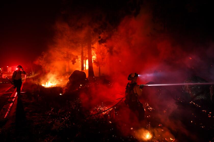 Lake Tahoe, CA. September 2, 2021: Firefighters battle battle the Caldor fire along highway 89 west of Lake Tahoe Thursday. (Wally Skalij/Los Angeles Times)