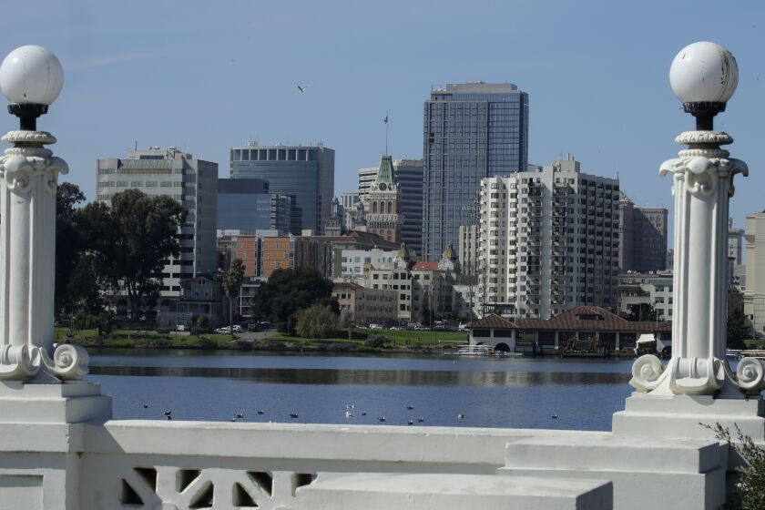 The Oakland skyline is seen from Lake Merritt on Wednesday, March 4, 2020, in Oakland, Calif. 