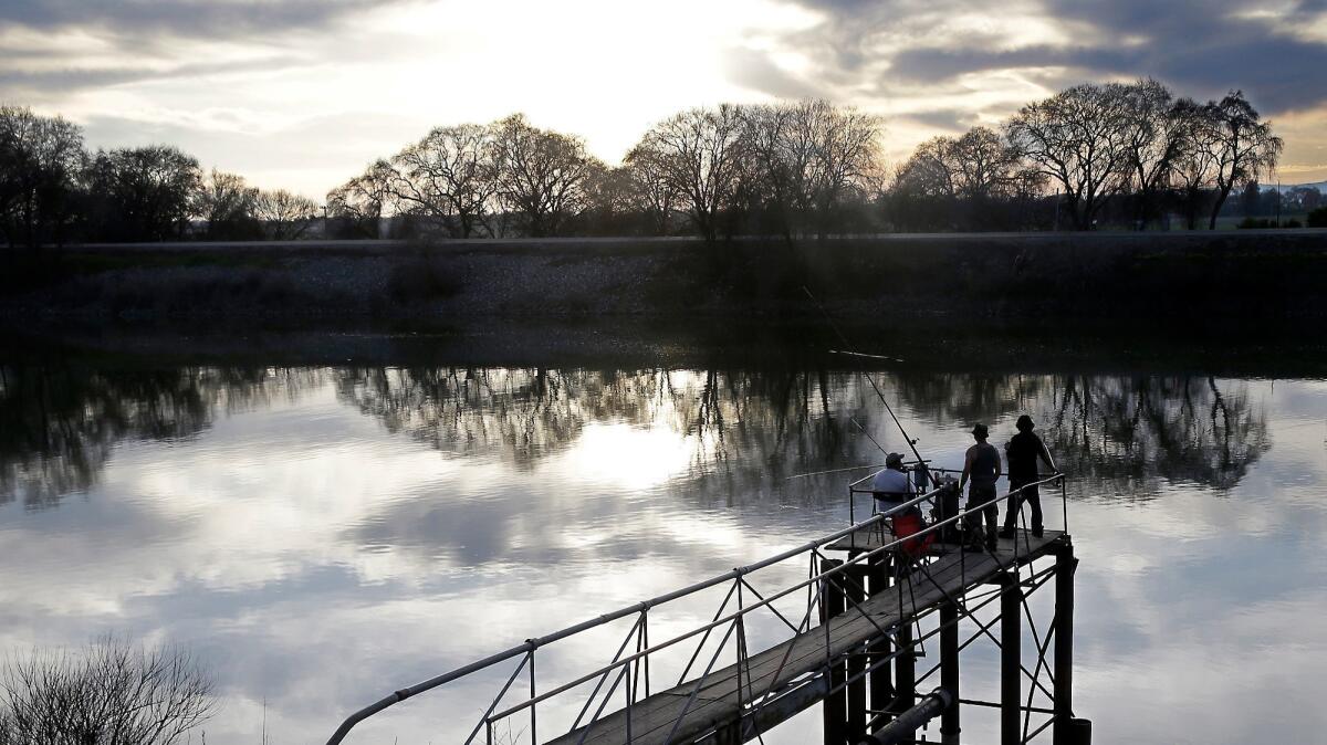 People fish in the San Joaquin-Sacramento River Delta near Courtland, Calif. on Feb. 23, 2016. The state's WaterFix plan will build two giant north-south water tunnels there.