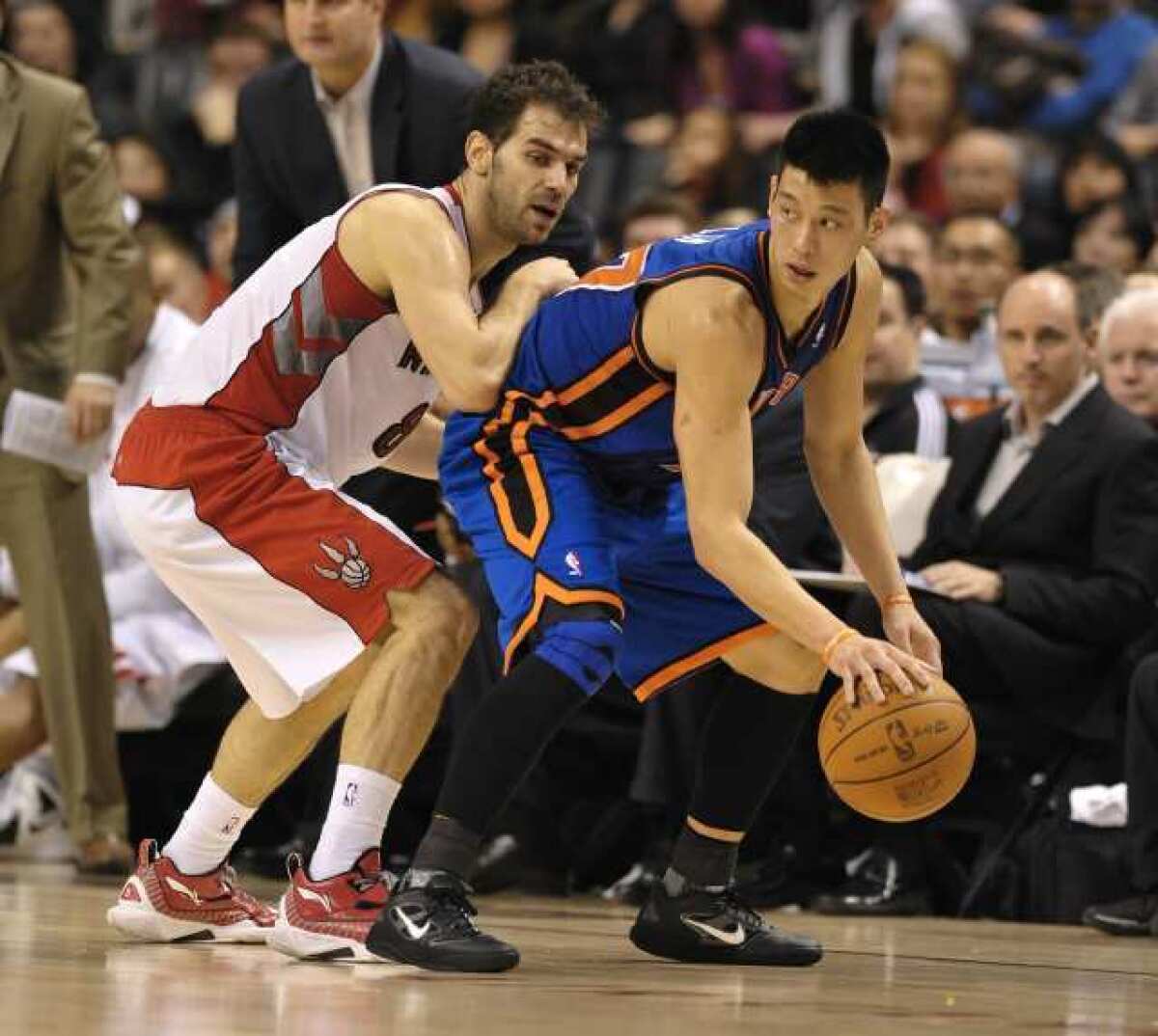 New York Knicks' Jeremy Lin (R) tries to get around Toronto Raptors Jose Calderon in the second half of their NBA basketball game in Toronto on Feb. 14.