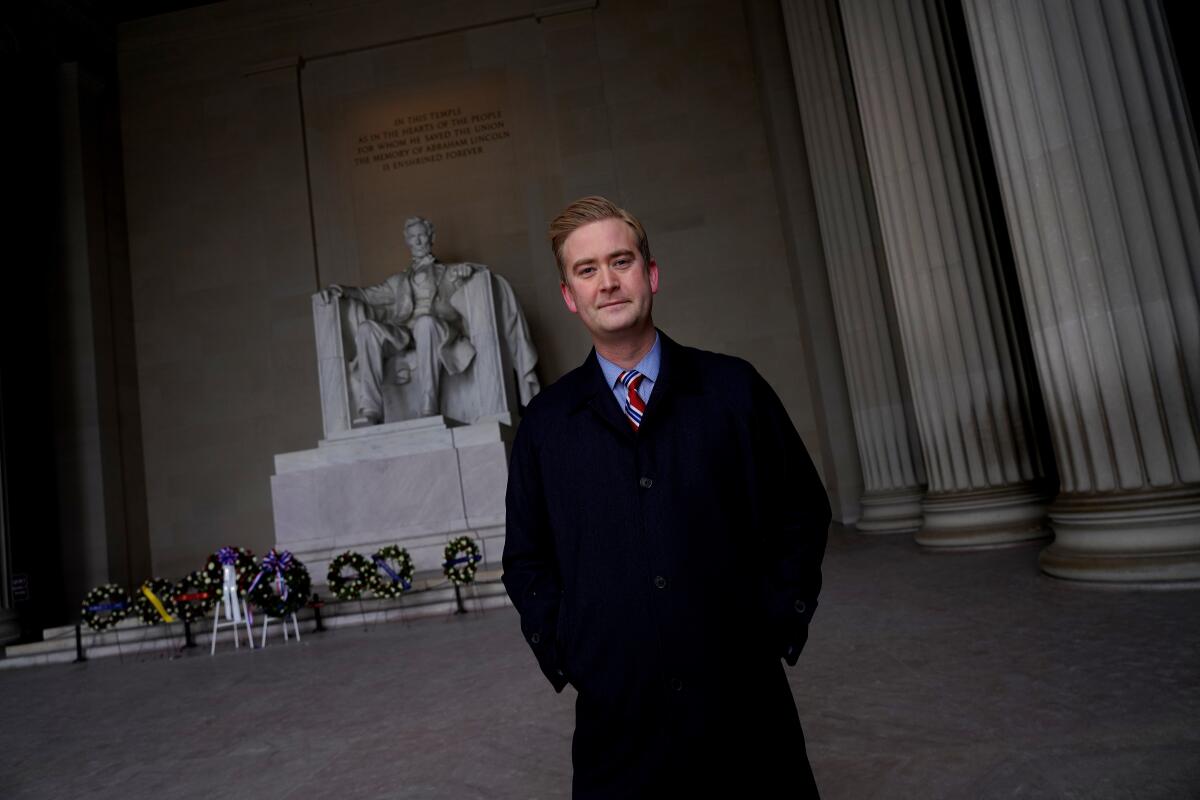 Peter Doocy stands in front of the Lincoln Memorial.