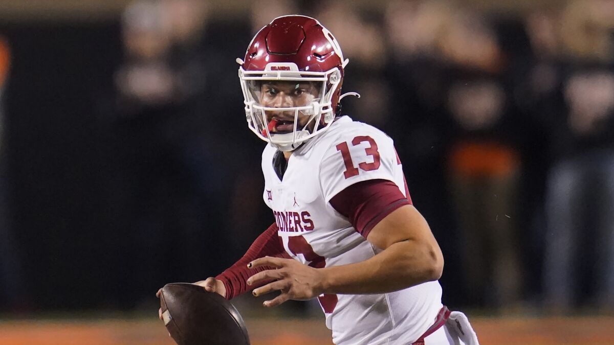 Oklahoma quarterback Caleb Williams scrambles during a game against Oklahoma State.