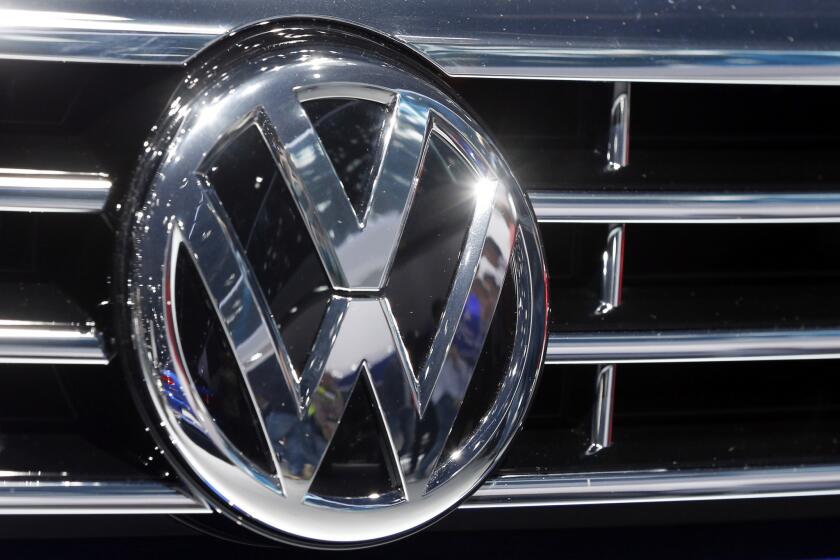 The Volkswagen logo is displayed on a vehicle at the Car Show in Frankfurt, Germany, on Sept. 22, 2015.
