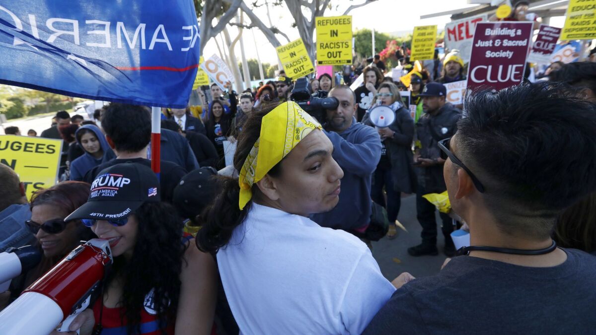 Immigrant advocates jostle with pro-Trump supporters in Los Alamitos, where the City Council voted to opt out of California's "sanctuary" law.