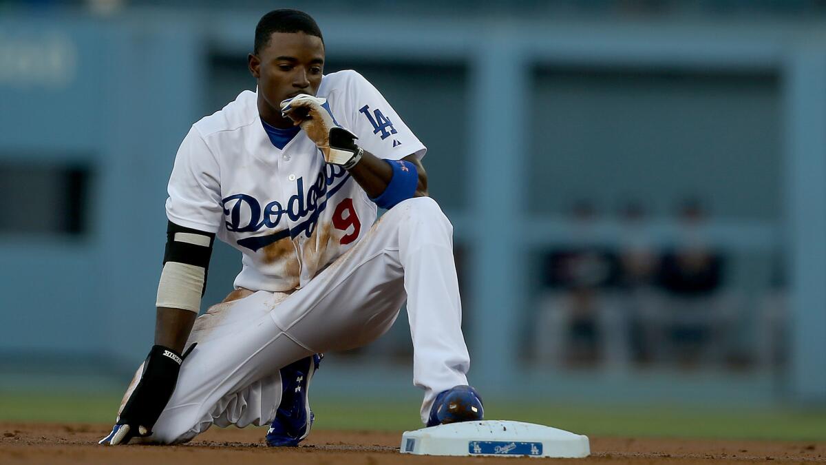 Dodgers second baseman Dee Gordon pauses after being tagged out while attempting to steal second during a game against the Atlanta Braves in July.