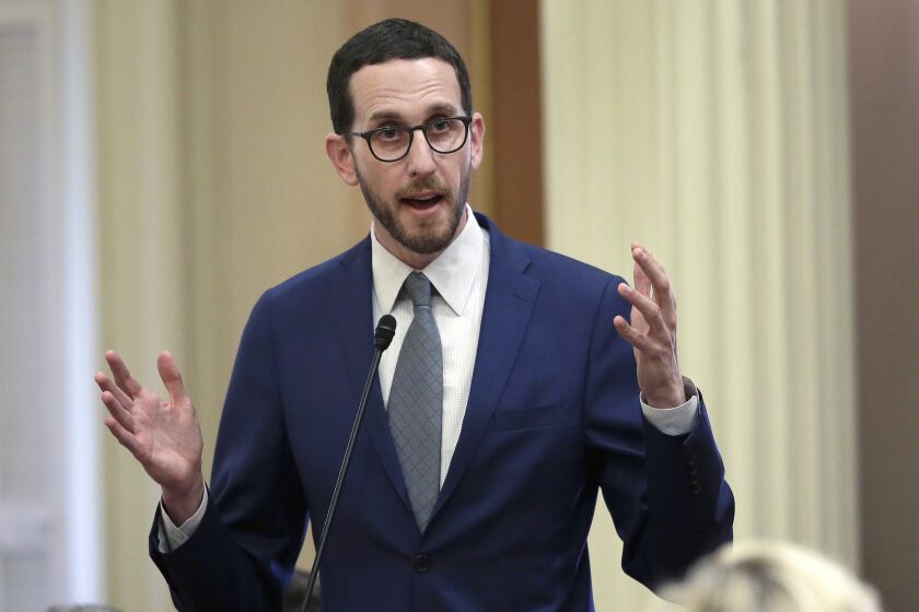 FILE - State Sen. Scott Weiner, D-San Francisco, talks during a Senate hearing in Sacramento, Calif., June 28, 2018. Democratic lawmakers in California are introducing a package of climate bills aimed at holding corporations accountable for their greenhouse gas emissions. (AP Photo/Rich Pedroncelli, File)