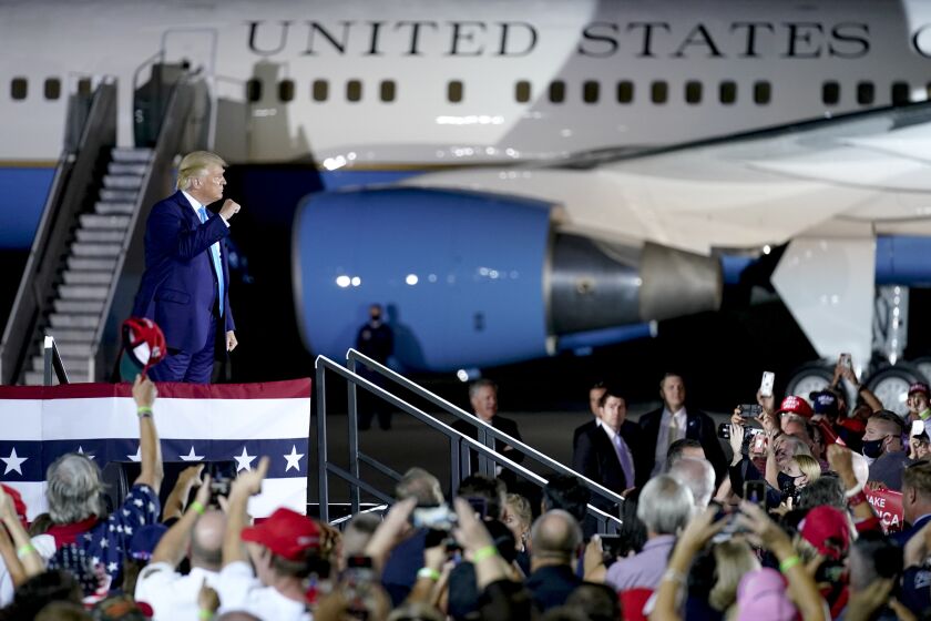 President Donald Trump cheers with a crowd at a campaign event at the Arnold Palmer Regional Airport, Thursday, Sept. 3, 2020, in Latrobe, Pa. (AP Photo/Keith Srakocic)