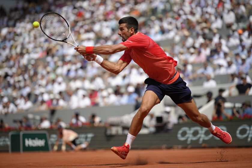 Serbia's Novak Djokovic plays a shot against Spain's Carlos Alcaraz during their semifinal match of the French Open tennis tournament of the French Open tennis tournament at the Roland Garros stadium in Paris, Friday, June 9, 2023. (AP Photo/Christophe Ena)