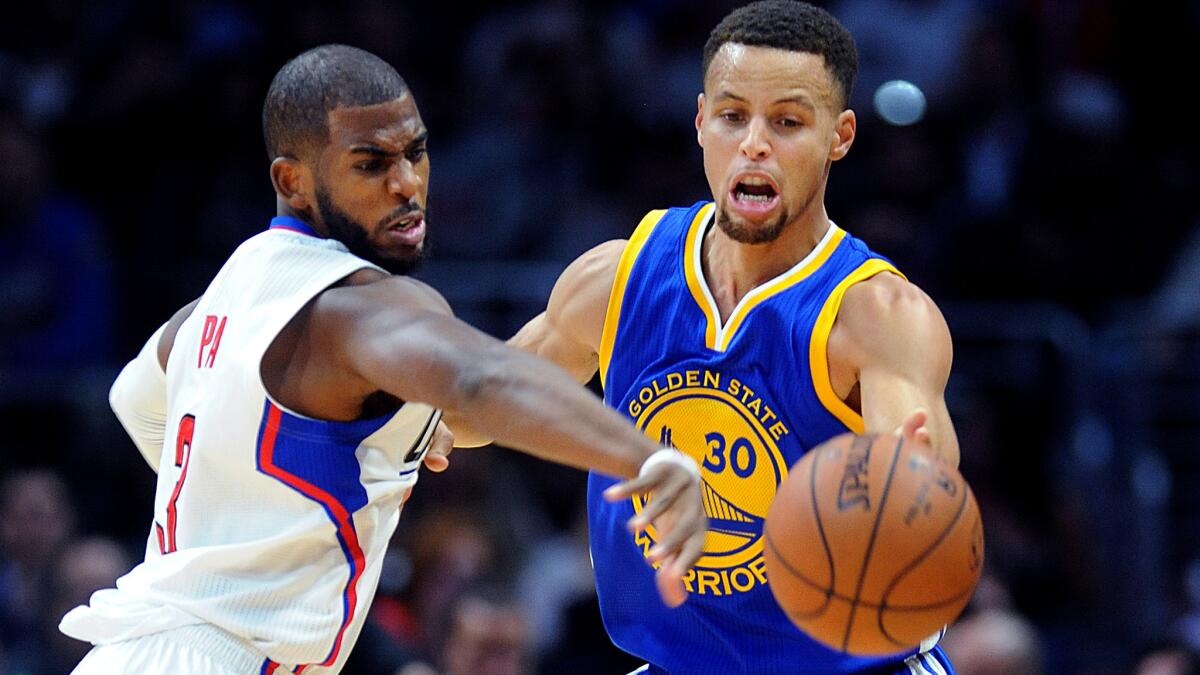 Clippers point guard Chris Paul, shown defending against Golden State's Stephen Curry (30), has been cleared to play but his return date has not been determined.