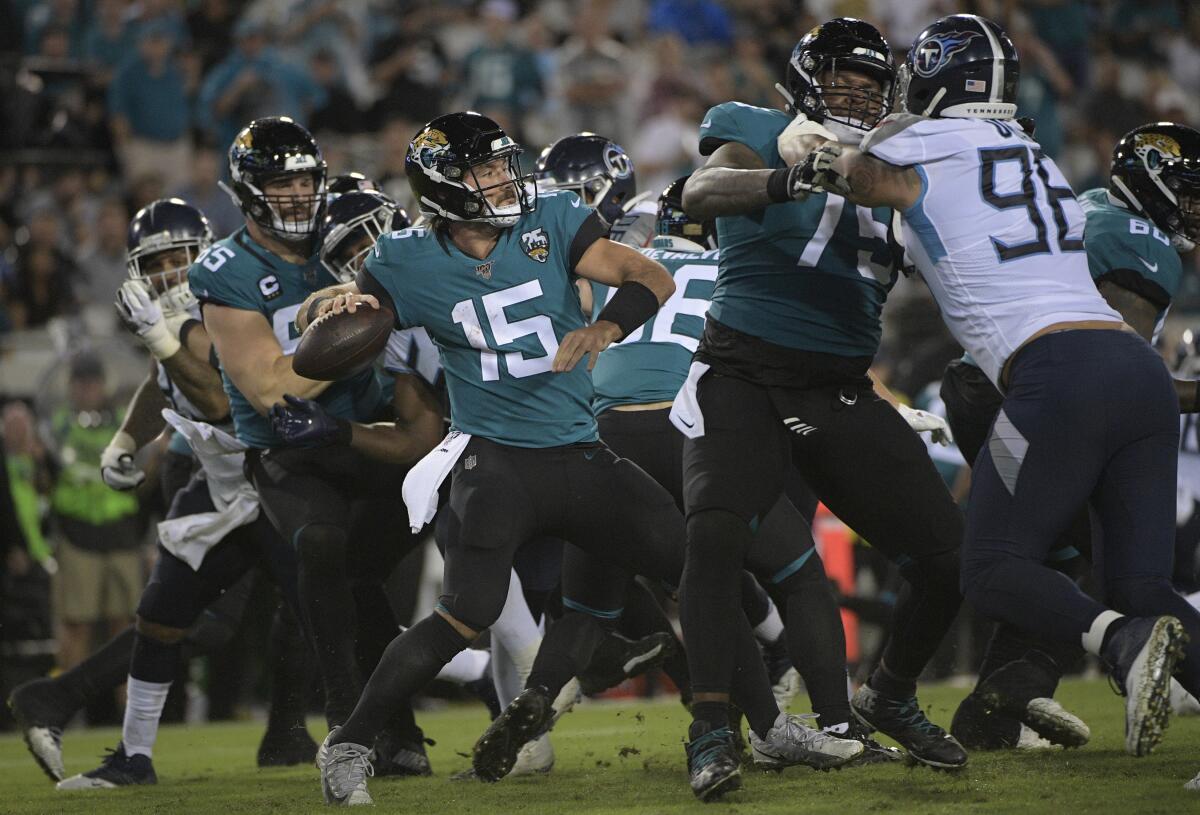 Jacksonville Jaguars quarterback Gardner Minshew II (15) throws a pass against the Tennessee Titans during the second half on Thursday in Jacksonville, Fla. 