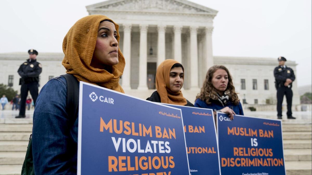 Members of the Council on American-Islamic Relations stand outside of the Supreme Court for an anti-Muslim ban rally on April 25.