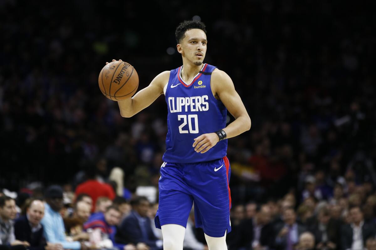 Clippers guard Landry Shamet brings the ball up court during a game against the 76ers.