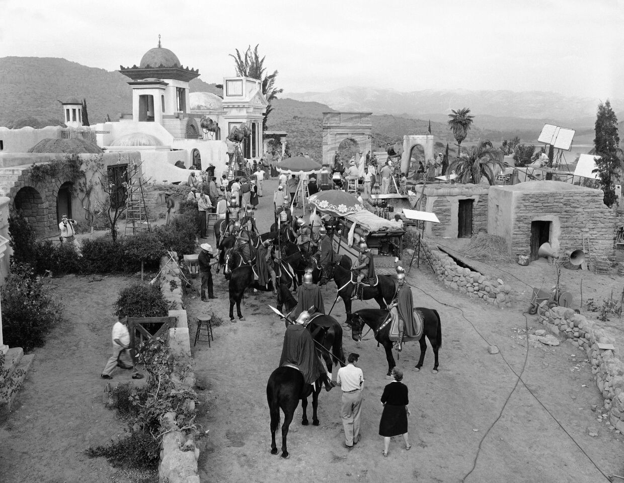 General view of the set built at Chatsworth, Calif., for "The Big Fisherman" on Oct. 24, 1958. The buildings depict the city of Tiberias built on a hill overlooking the Sea of Galilee. In the foreground are extras dressed as Roman soldiers awaiting their cue to ride.