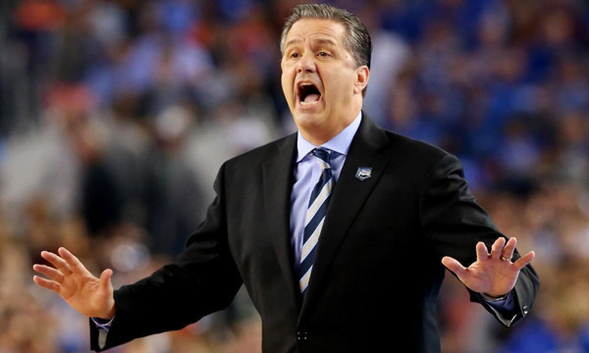 Kentucky Coach John Calipari instructs his players during Monday's NCAA championship game against Connecticut. Is Calipari interested in coaching the Lakers?