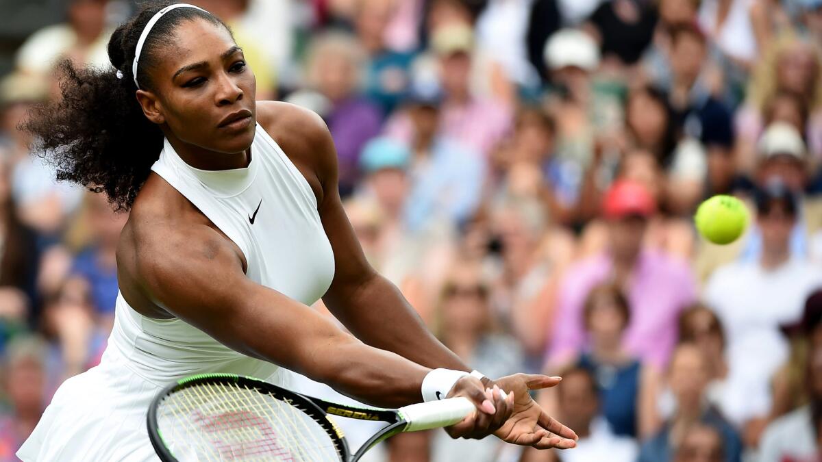 Serena Williams volleys a shot during her victory over Annika Beck on Sunday at Wimbledon.
