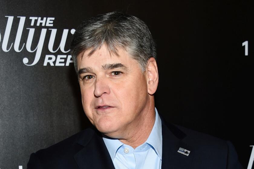 FILE - In this April 12, 2018 file photo, Fox News personality Sean Hannity attends The Hollywood Reporter's annual 35 Most Powerful People in Media event in New York. Hannity is President Donald Trump's most vocal defender on television, and a week ago he was on the air criticizing the FBI raid on the president's personal attorney Michael Cohen as evidence that Special Counsel Robert Mueller's "witch hunt" against the president has become a runaway train. It was revealed in a court hearing Monday, April 16, that Cohen also represented Hannity. (Photo by Evan Agostini/Invision/AP, File)