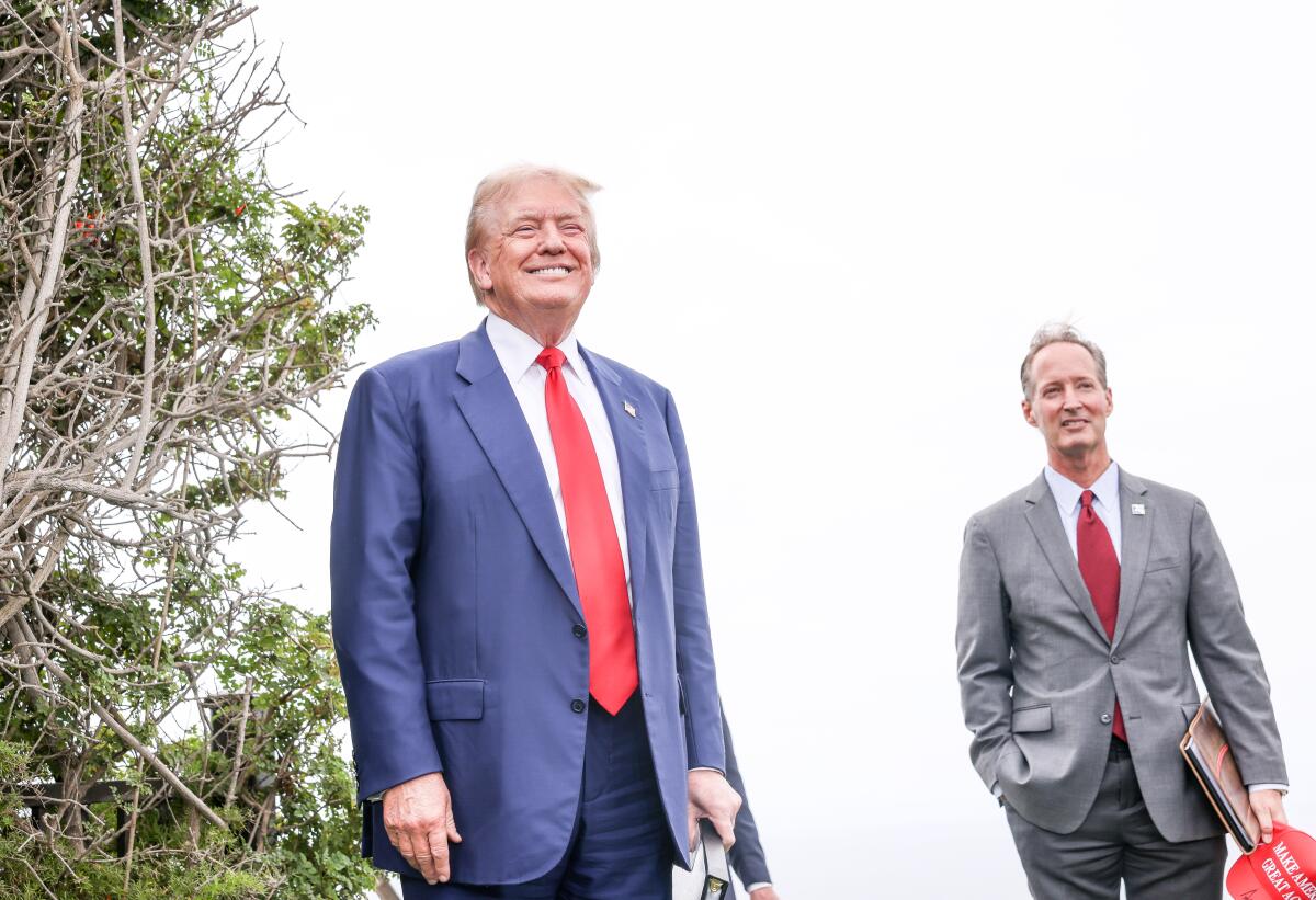 Former President Trump stands with Rancho Palos Verdes Mayor John Cruikshank