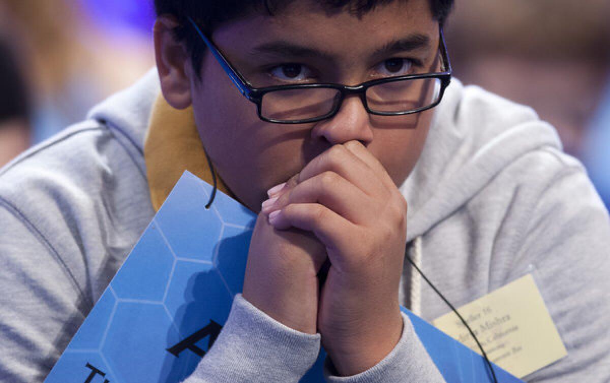 Aditya Mishra of Lincoln, Calif., waits for his turn during the third round of the National Spelling Bee in Oxon Hill, Md.