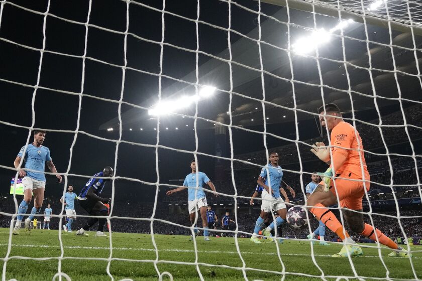 Manchester City's goalkeeper Ederson makes a save from Inter Milan's Romelu Lukaku during the Champions League final soccer match between Manchester City and Inter Milan at the Ataturk Olympic Stadium in Istanbul, Turkey Saturday, June 10, 2023. (AP Photo/Antonio Calanni)