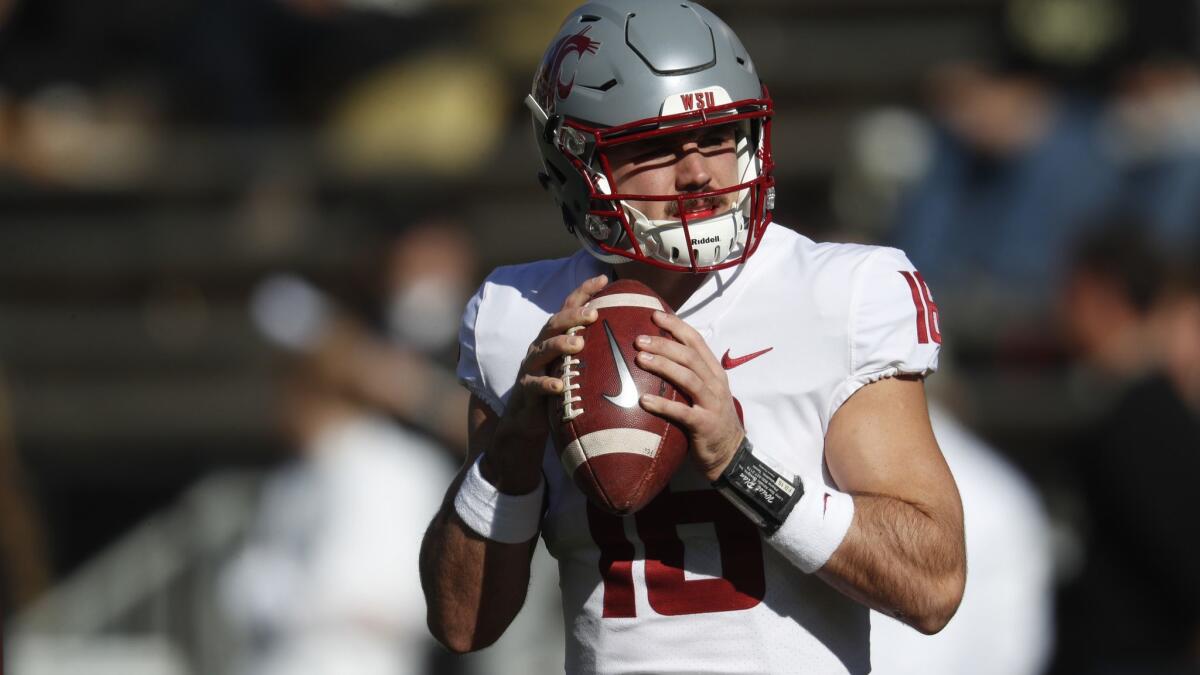 Washington State quarterback Gardner Minshew warms up before the first half against Colorado on Saturday.