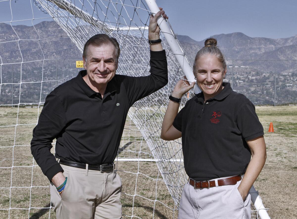 Former Flintridge Sacred Heart Academy soccer coaches Frank Pace and Kathy Desmond, at the La Canada Flintridge school on Thursday, January 23, 2014. Both will be inducted into the school's athletic hall of fame soon.