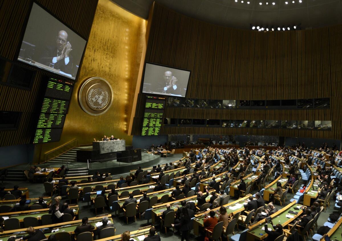 Delegates to the United Nations General Assembly applaud the passage of the first U.N. treaty regulating the international arms trade on Tuesday.