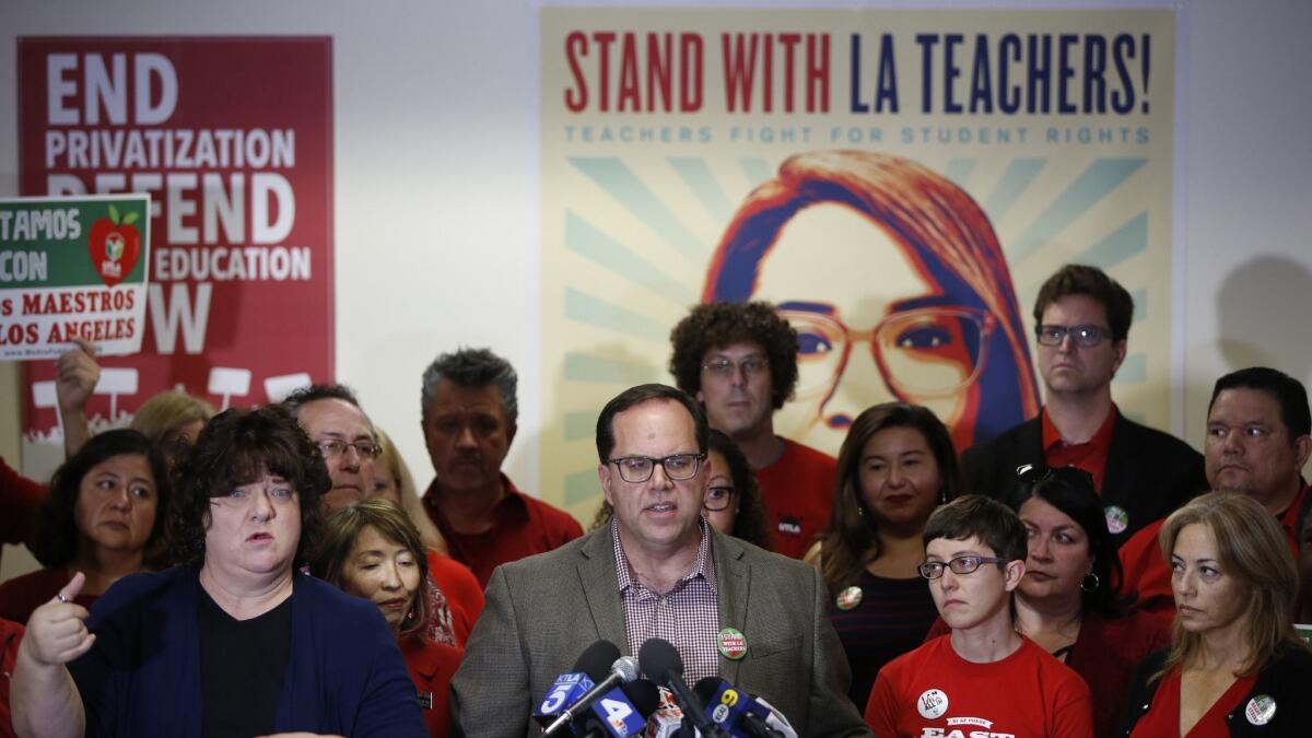United Teachers Los Angeles President Alex Caputo-Pearl, center at podium, announces Jan. 13 that the union's members will go on strike.
