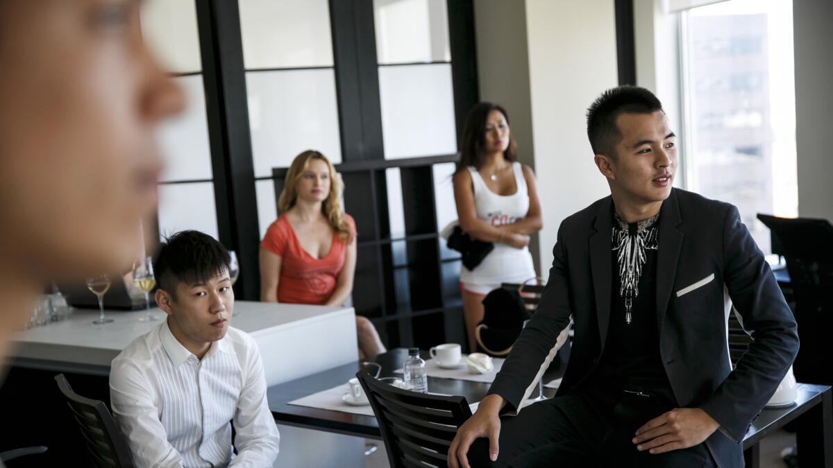 From left, Ivan Ceron, Kevin Chen, Kelly Pantaleoni, Katharine Chen and Rudy Rong, during a film shoot for Rong's interactive virtual reality startup, in Los Angeles.