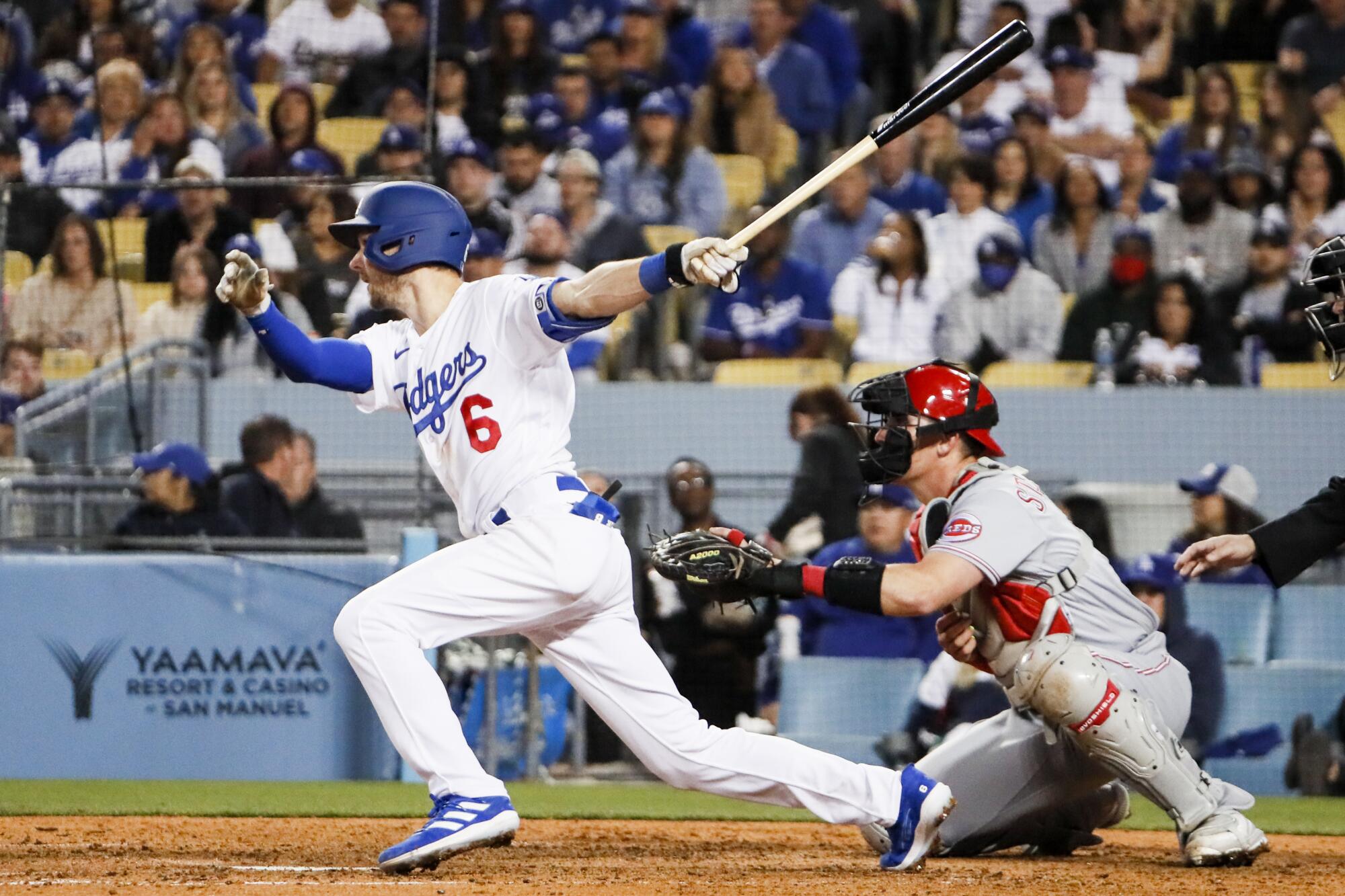 Dodgers shortstop Trea Turner follows through on a run-scoring single to drive in the go-ahead run.