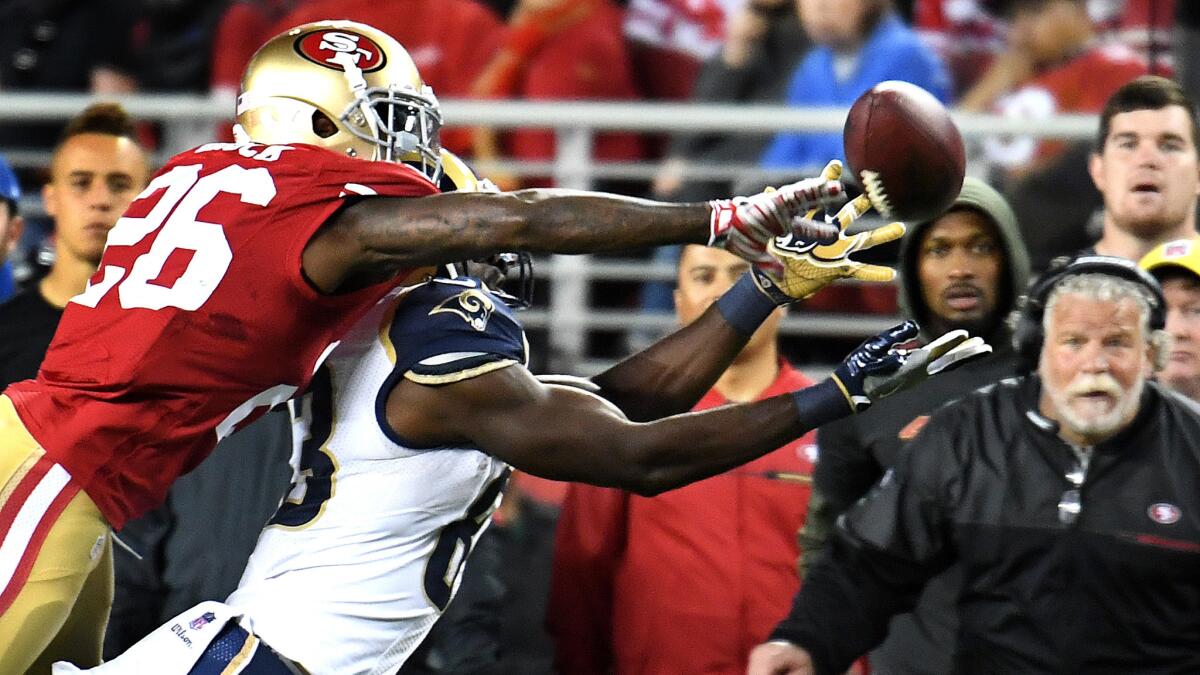 49ers cornerback Tramaine Brock knocks the ball away from Rams receiver Brian Quick on Monday.