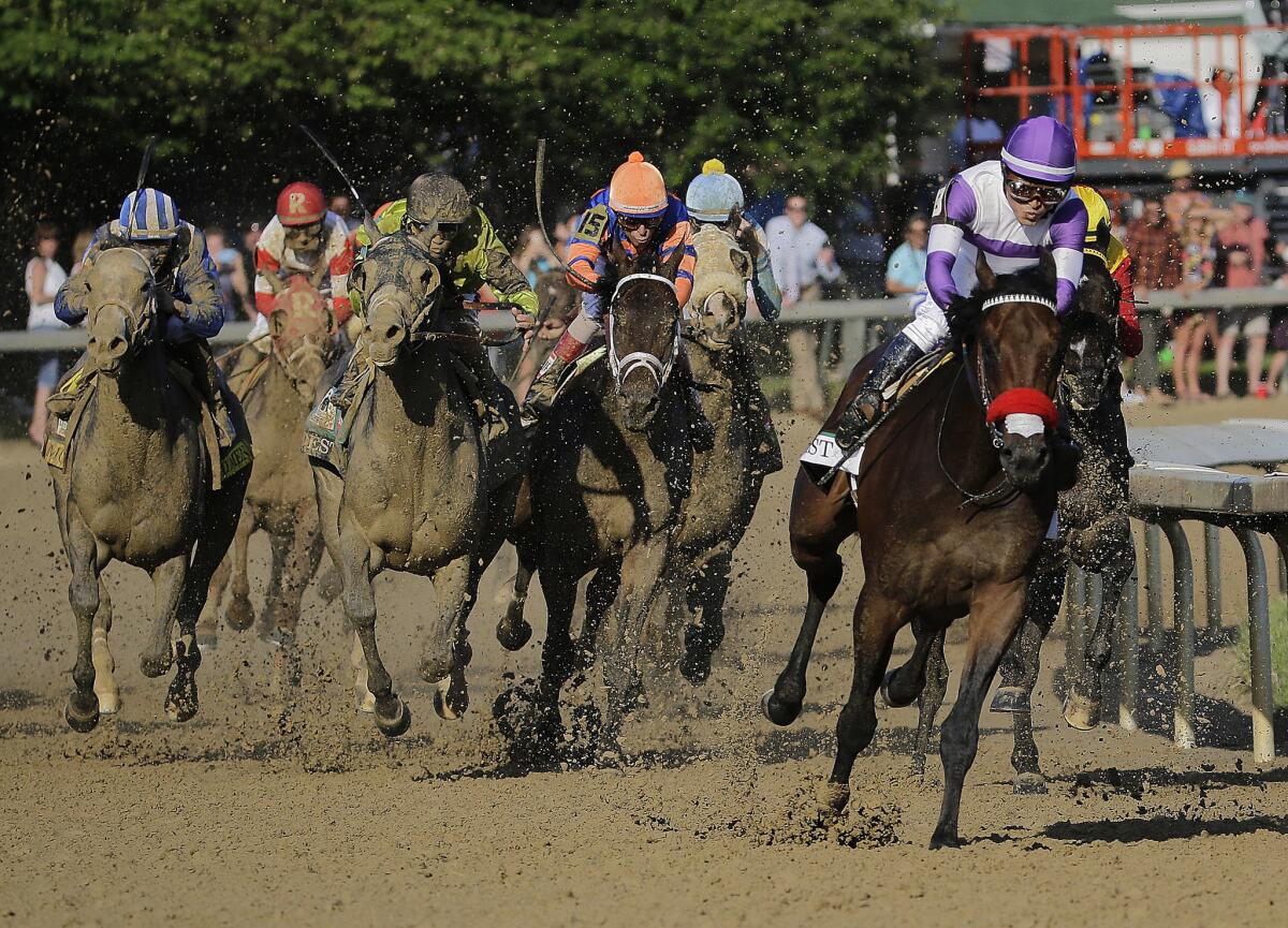 Nyquist, with Mario Gutierrez aboard, pulls away from the field at the top of the homestretch during the 142nd Kentucky Derby.