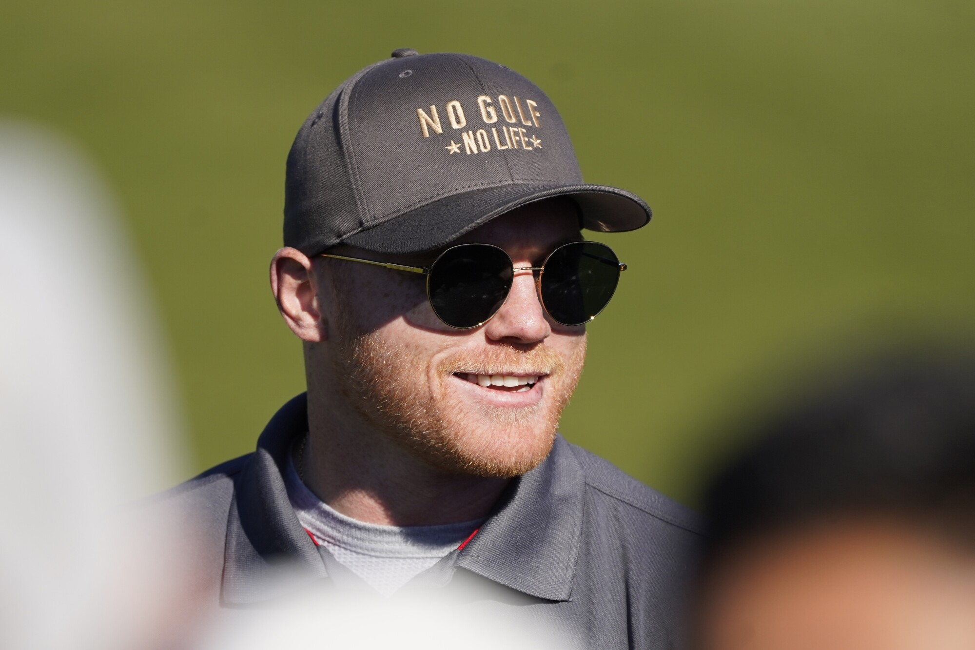 Canelo Alvarez smiles while competing in the AT&T Pebble Beach Pro-Am in February.