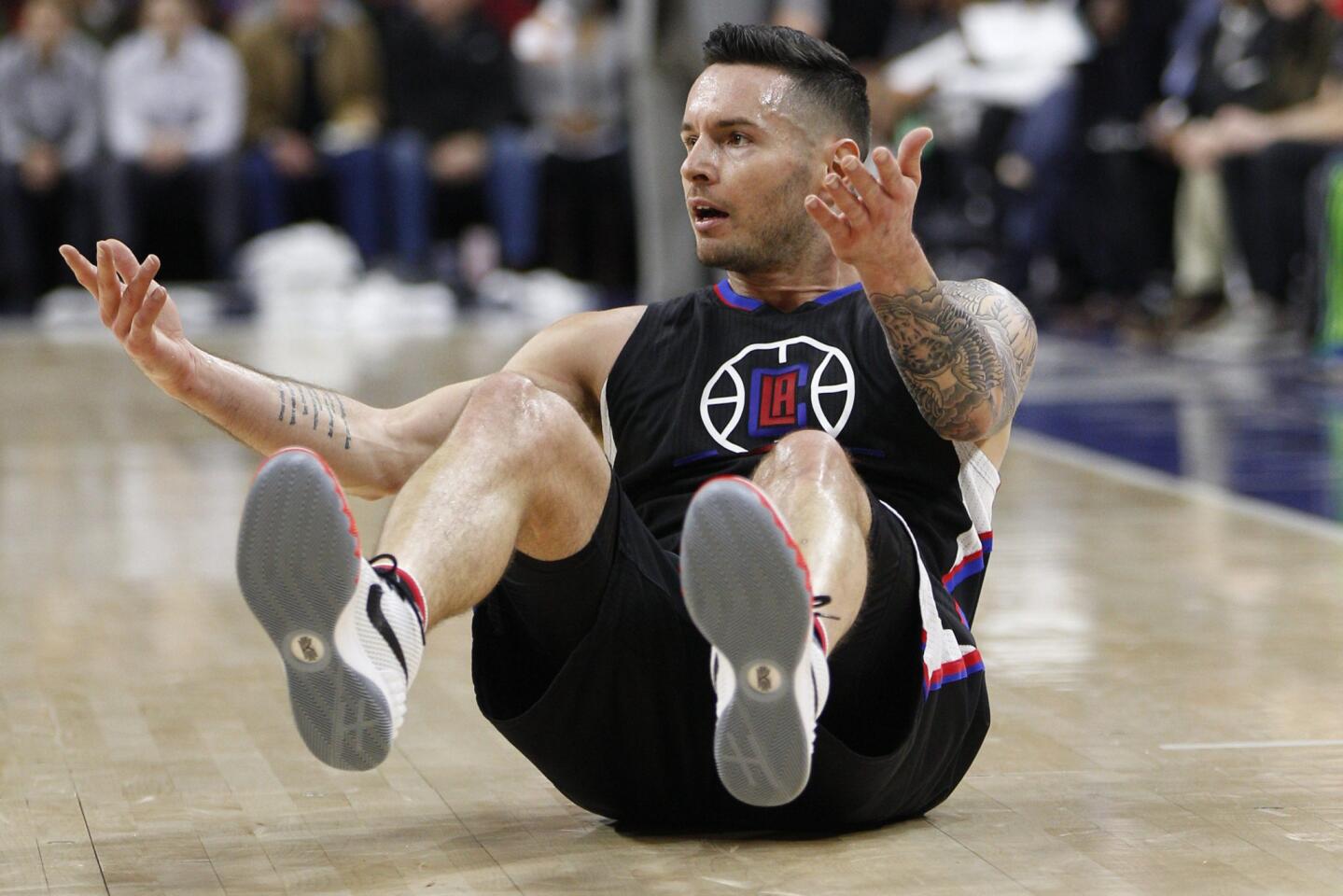 Clippers guard J.J. Redick (4) reacts to not getting a foul call during the first half.