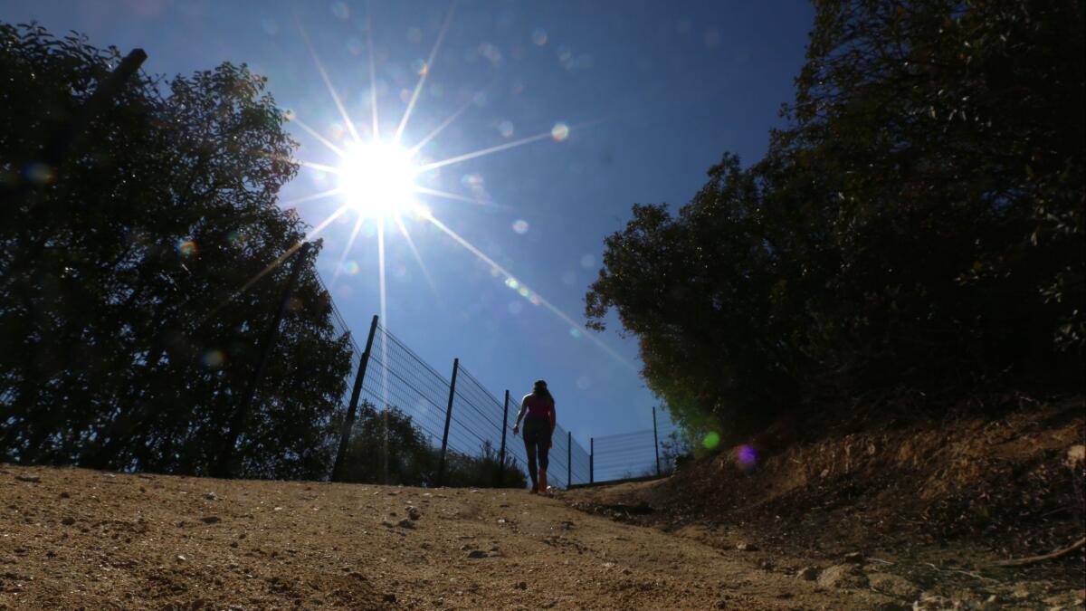 A hiker makes her way up Descanso Trail.