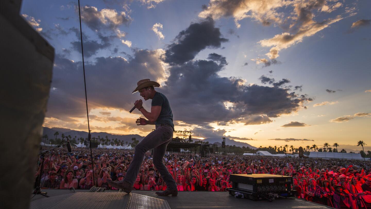 Dustin Lynch performs against a desert sunset at Stagecoach Country Music Festival in Indio.