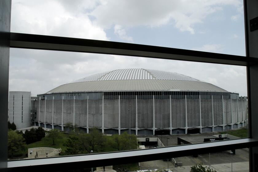 Houston's Astrodome, once called "The Eighth Wonder of the World," is seen through the windows of the Club Level of Reliant Stadium.