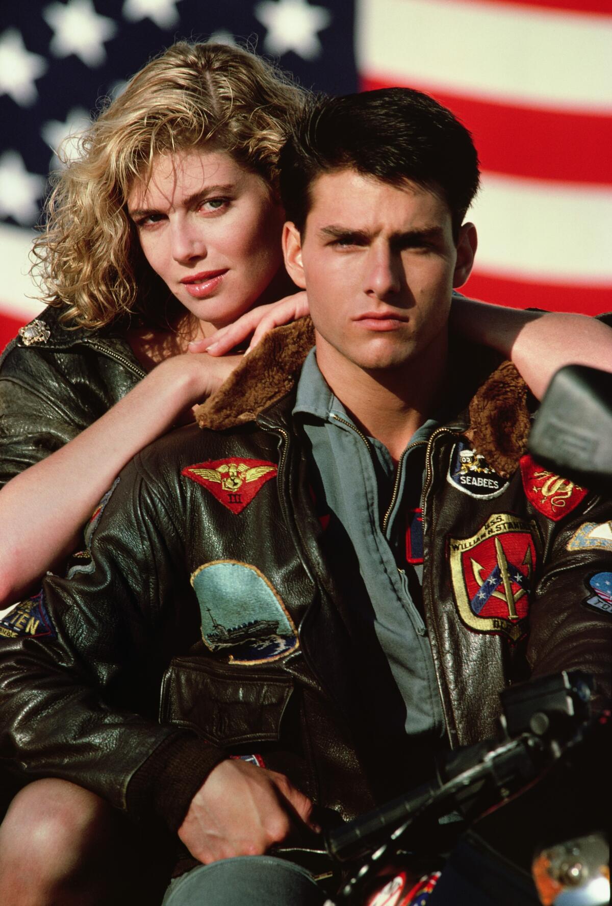 In this film publicity image released by Paramount Pictures, Kelly McGillis, left, and Tom Cruise 