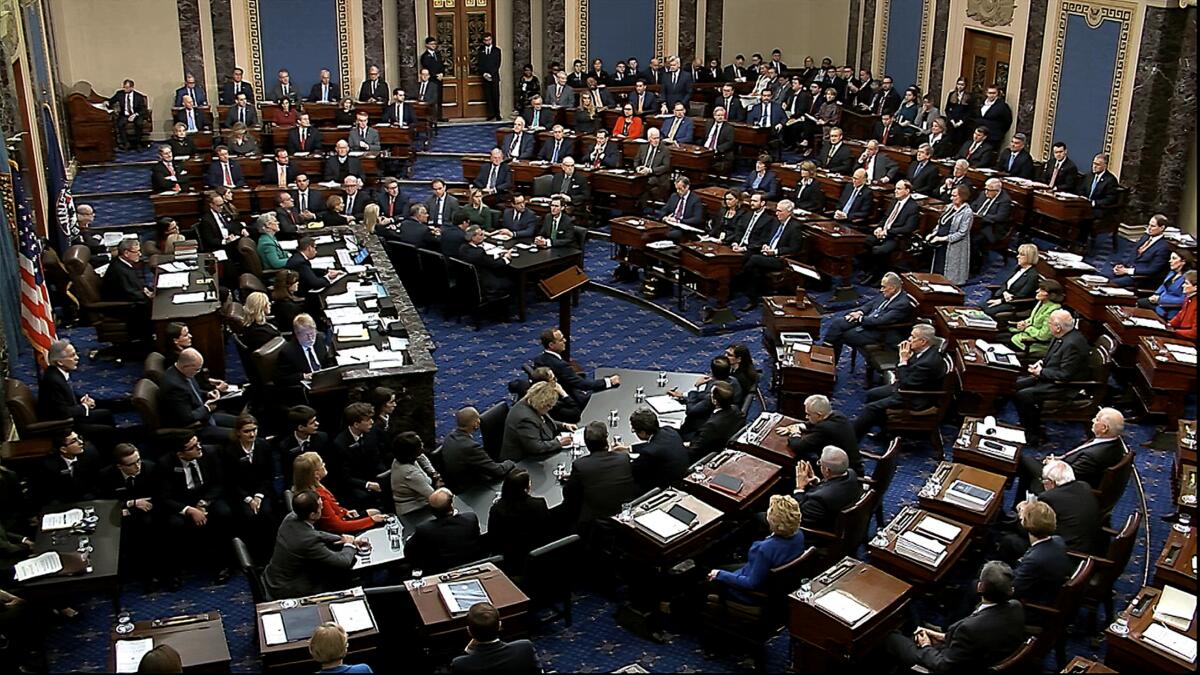 Senators vote on the first article of impeachment in the trial against President Trump. 