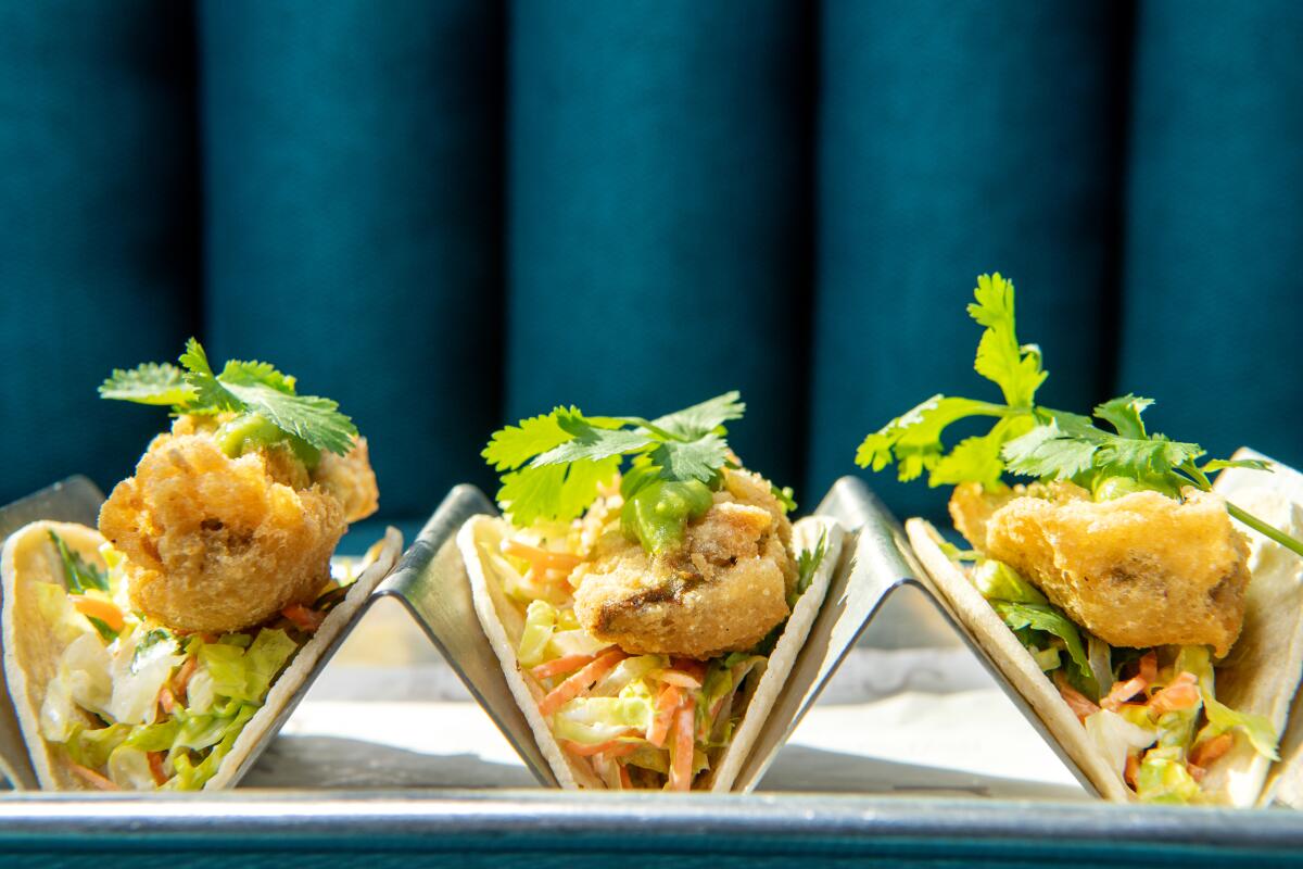 A trio of vegan tempura tacos from Nic's on Beverly