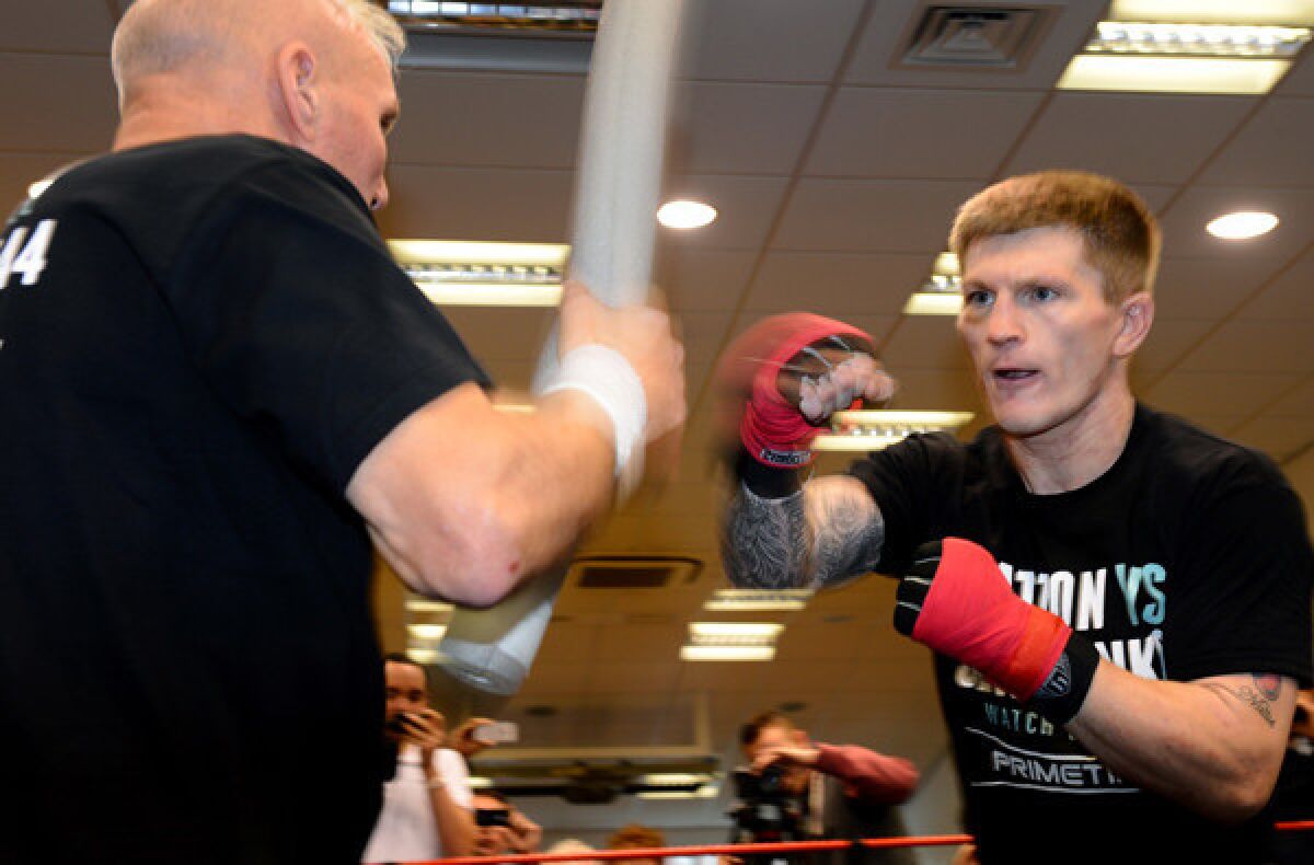 Ricky Hatton works with trainer Bob Shannon during a session Wednesday in England.