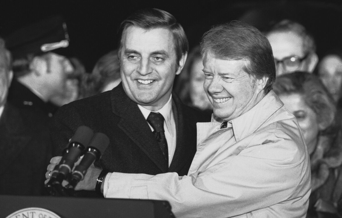 President Jimmy Carter embraces Vice President Walter Mondale on the South Lawn of the White House