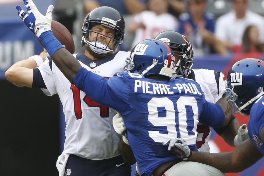 Ryan Fitzpatrick throws under pressure from New York Giants defensive end Jason Pierre-Paul in September.