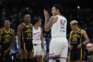 Phoenix Mercury center Brittney Griner (42) applauds on the court before a WNBA basketball game.