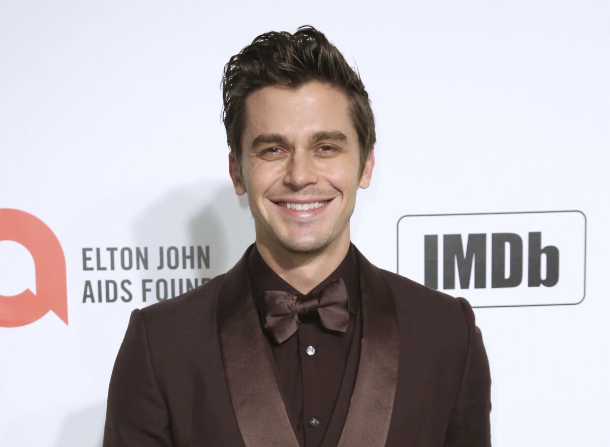 FILE - Antoni Porowski appears at the 2020 Elton John AIDS Foundation Oscar Viewing Party in West Hollywood, Calif., on Feb. 9, 2020. The Gay, Lesbian and Straight Education Network will recognize the “Queer Eye” star and author with its Champion Award at a May 16 gala ceremony in New York. (Photo by Willy Sanjuan/Invision/AP, File)