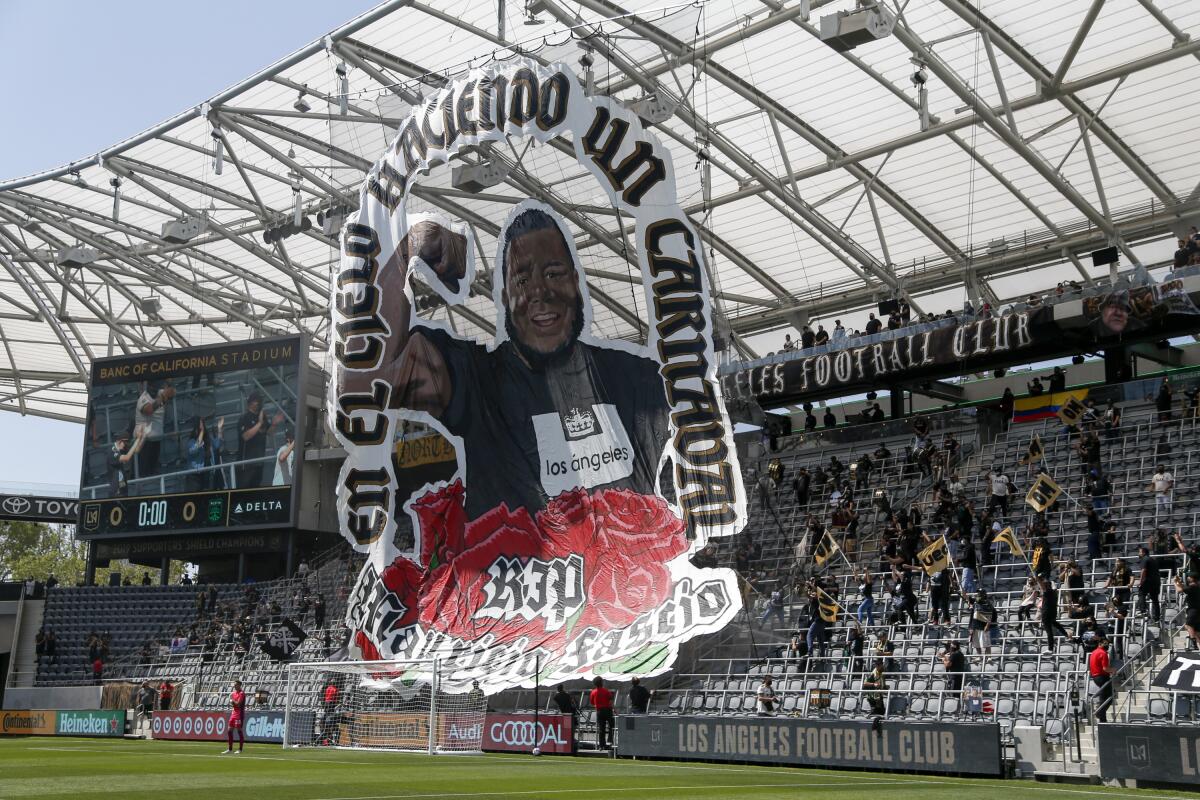 A giant banner with the picture of Mauricio "Mo" Fascio is displayed during the first half of a recent LAFC match.